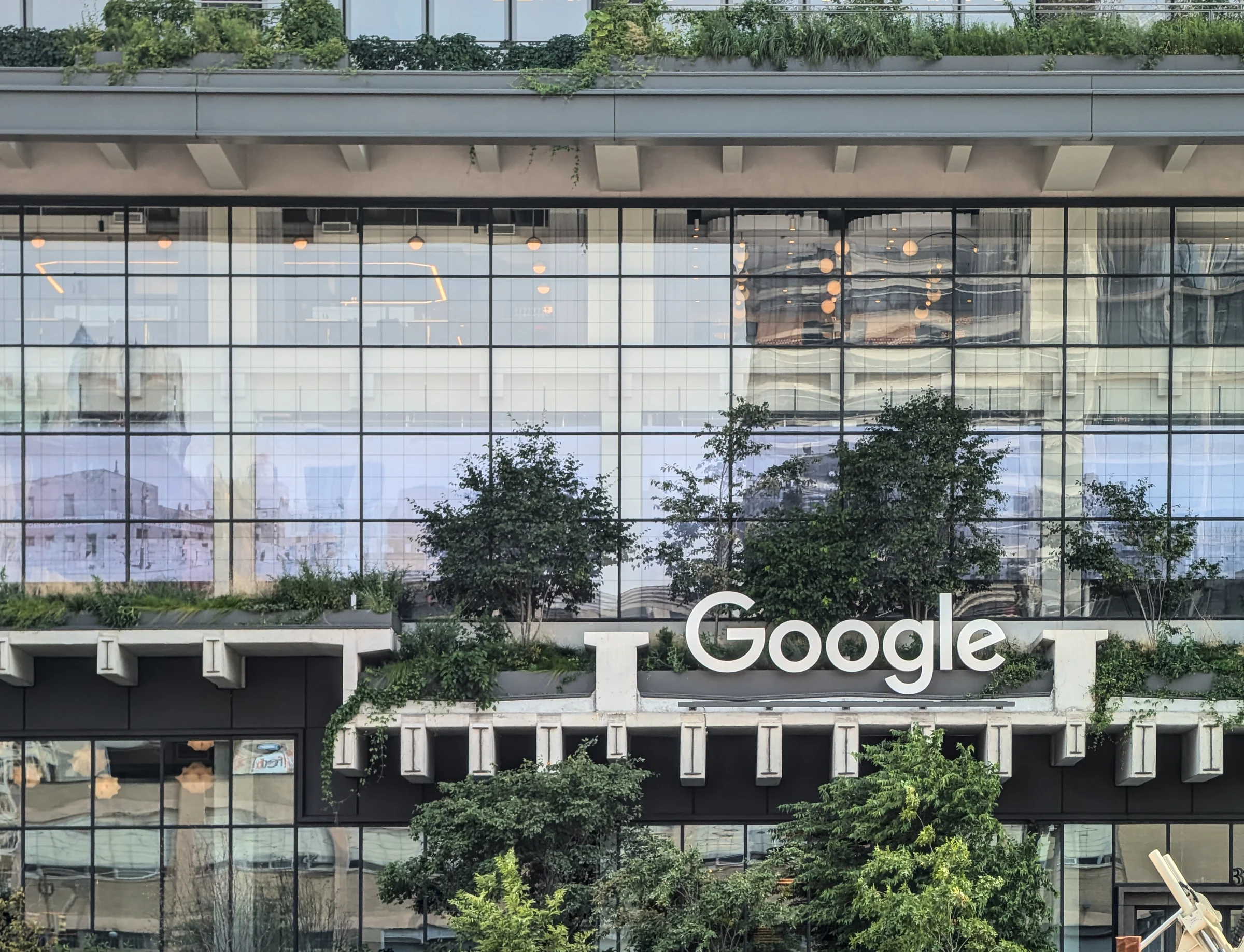 July 18, 2024: Google tech giant company logo on the front of new corporate headquarters building at St. John's Terminal, Houston street at Washington st, Manhattan, New York City.